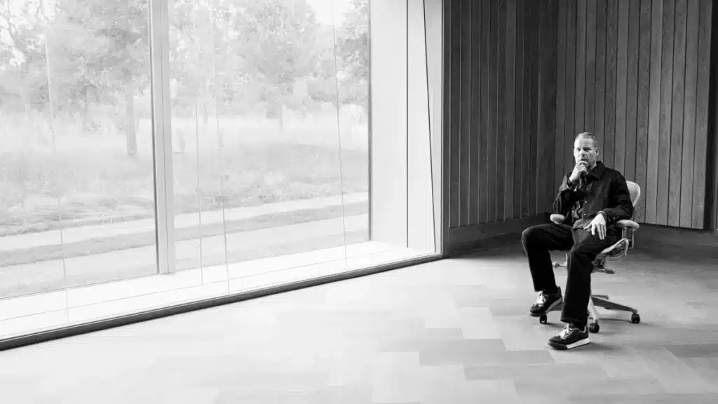 Max Richter in studio preparing for “Songs of a Jumping Universe” launch on Apple Music Chill, surrounded by instruments and soundboards.