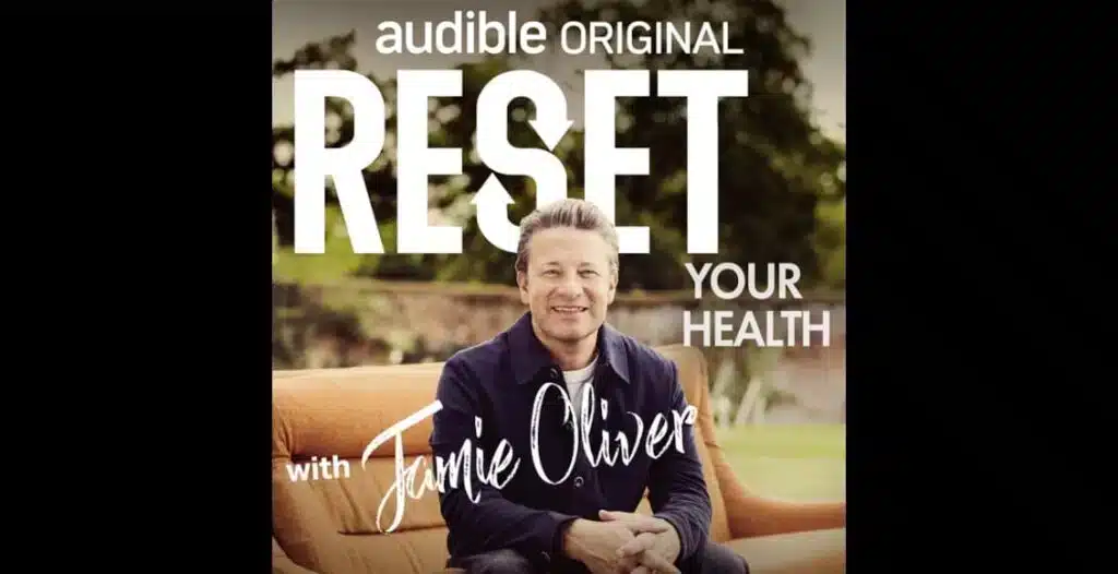 Podcast cover of Jamie Oliver smiling while recording his Audible health podcast “Reset Your Health”