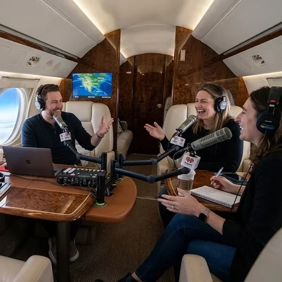 Podcast microphones setup inside private jet during flight at 43000 feet